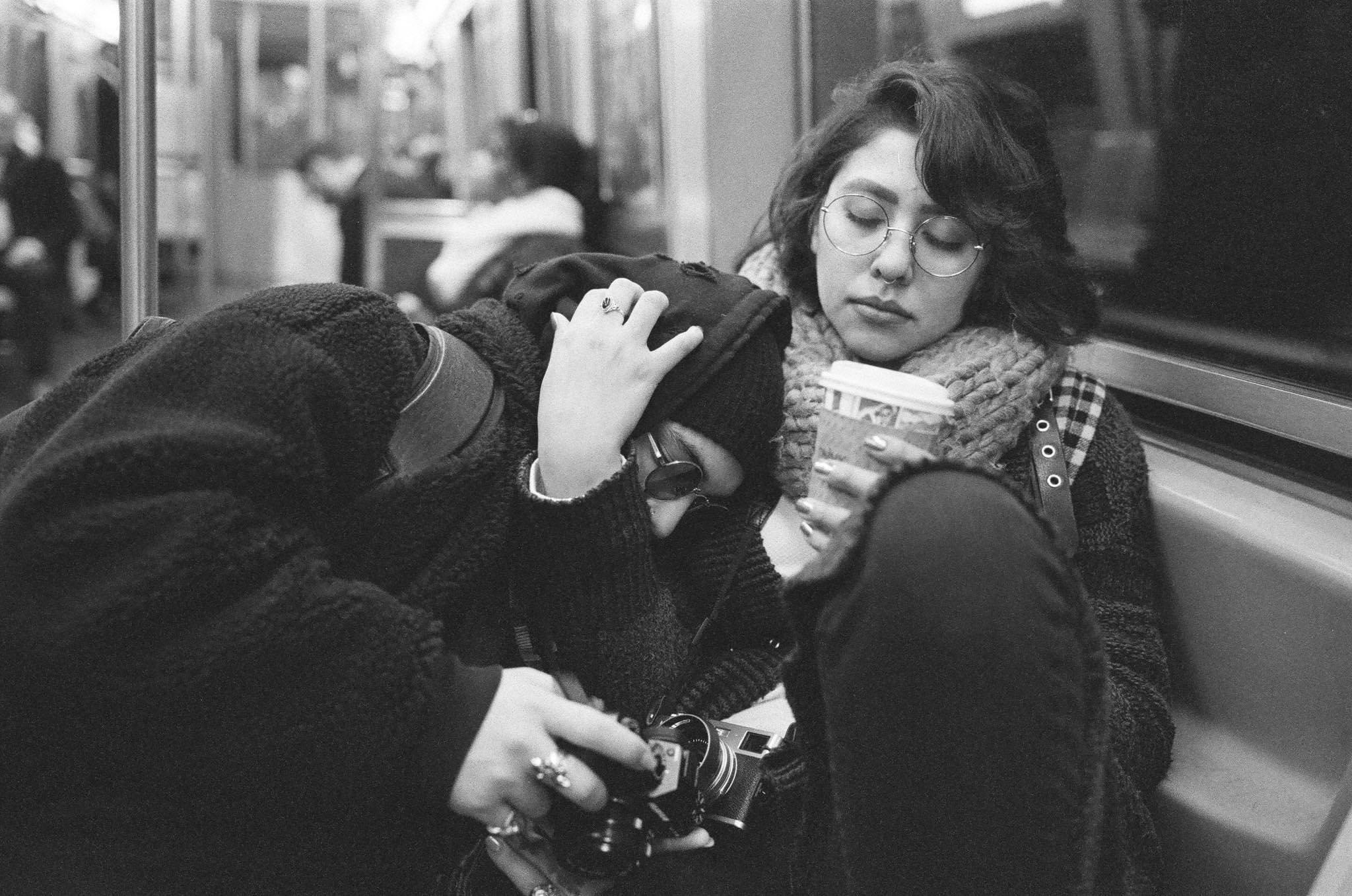 Jack-Peter and Flor de Liz riding on a NYC train after a long day of exploring Manhattan with their close friend, Miguel Cortes.