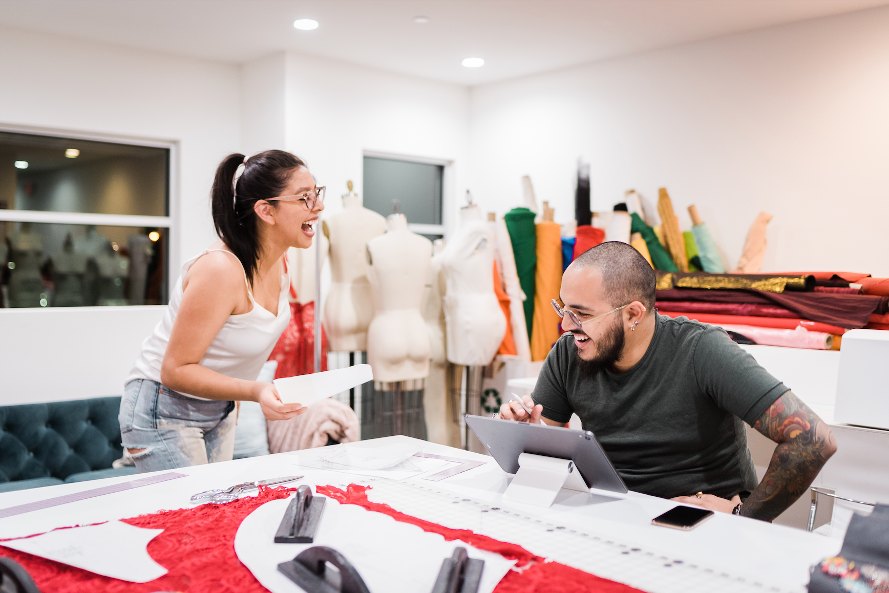 Power fashion couple, Jack-Peter and Flor de Liz, working together in their Las Vegas, NV fashion atelier to create a custom design for a private client for their special event.