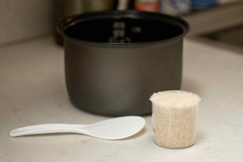 Step by step guide to using a rice cooker - measure your rice