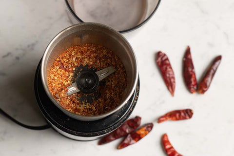 chilli flakes in a grinder