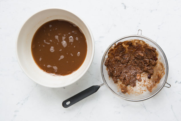 tamarind water strained through a sieve