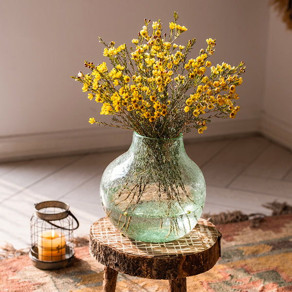 Bouquets of natural dried plants of dried flowers that retain their shape  and bright colors in glass vases for the art of making flower compositions.  Stock Photo