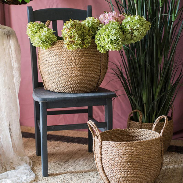 https://cdn.shopify.com/s/files/1/0111/2994/6171/products/khaki-brown-solid-color-straw-basket-with-handles-rusticreach-585929.jpg?v=1569677592&width=600