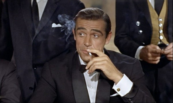 Sean Connery in the film Doctor no wearing a evening smoking jacket with silk facings and turnback cuffs. 