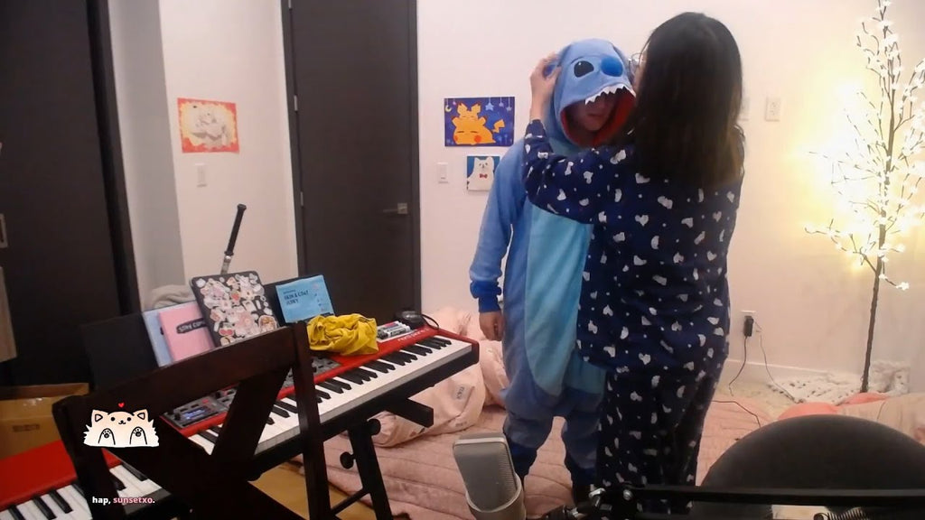 stitch kigurumi fixing her head by her mother