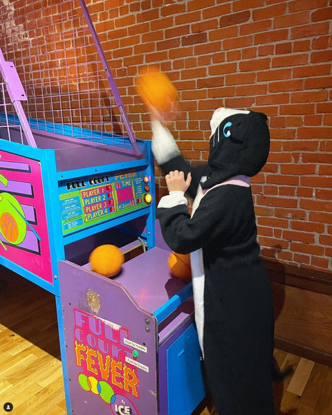 Black Cat Kigurumi playing basketball