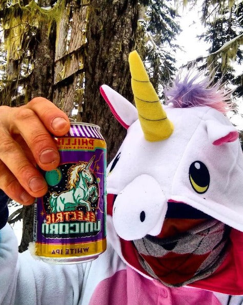 White unicorn kigurumi drinking a can of beer