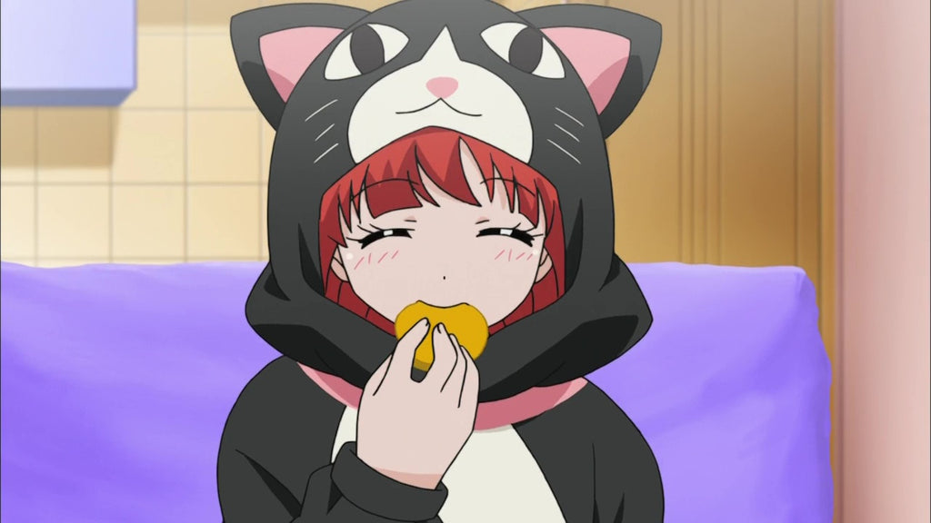 cat kigurumi eating a macaron