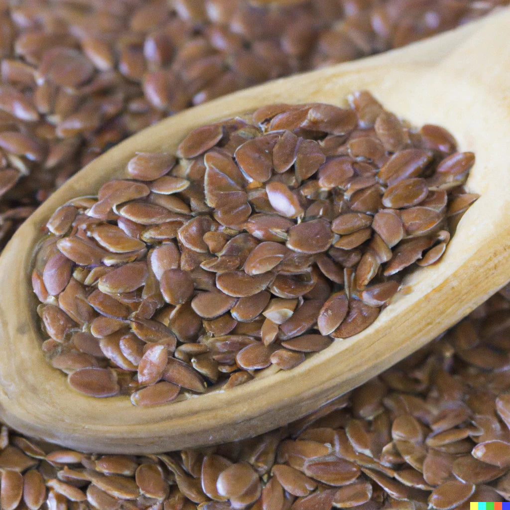 An image of raw brown flaxseeds in a wooden spoon