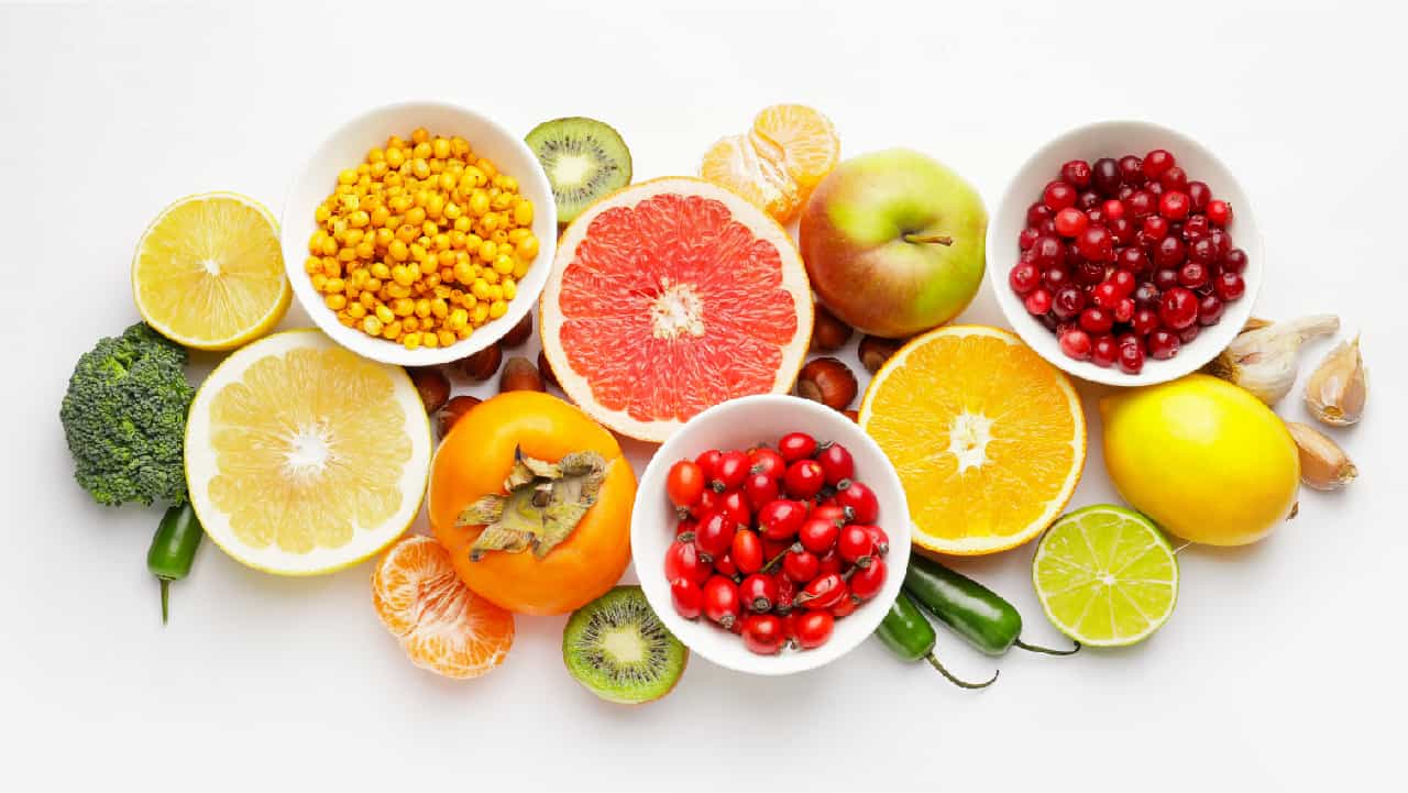 What is vitamin C and why do we need it? It's an essential nutrient found in foods pictured here, including citrus fruits, kiwis, peppers, broccoli, tomatoes, cranberries and corn
