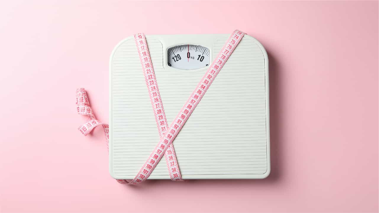 Body weight scales and tape measure, indicating at home ways to measure your body fat percentage