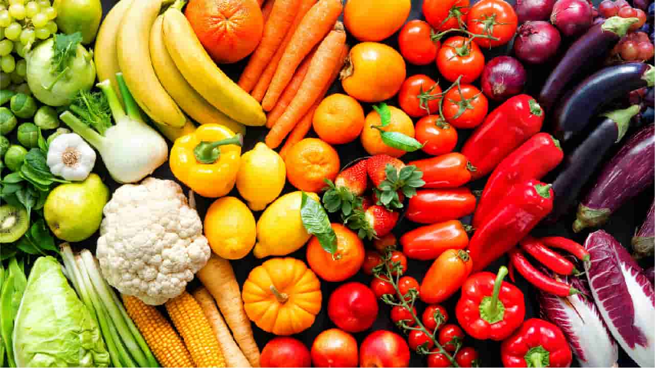 A colourful variety of health foods such as bananas, tomatoes, cauliflower and aubergines