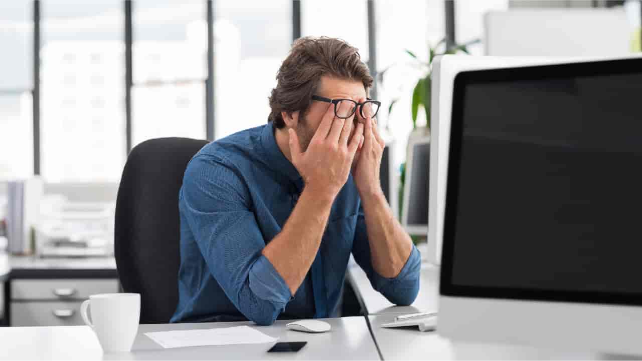 Man stressed out at work indicating bad mental health