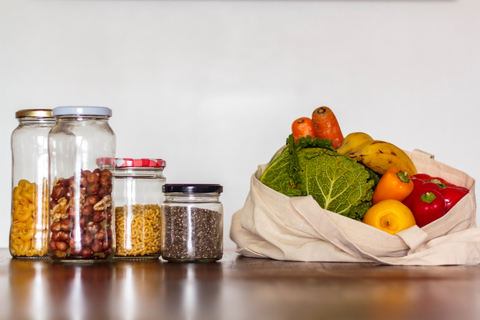 groceries in jars and vegetables in bag