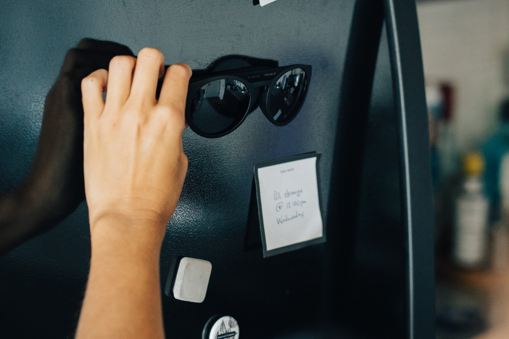 Someone puts their pair of polarized MagLock sunglasses onto the fridge with magnets