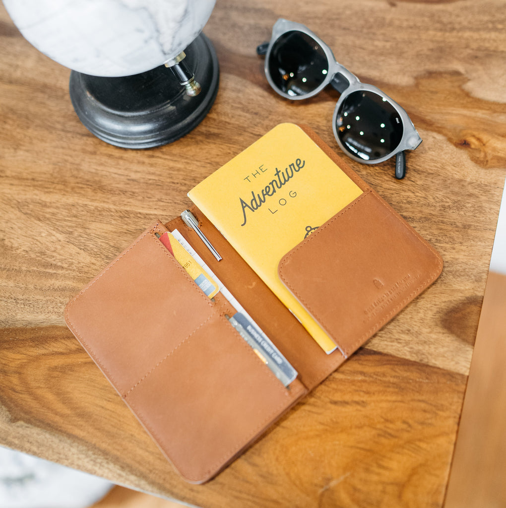 passport cover+ on desk with cooper sunglasses