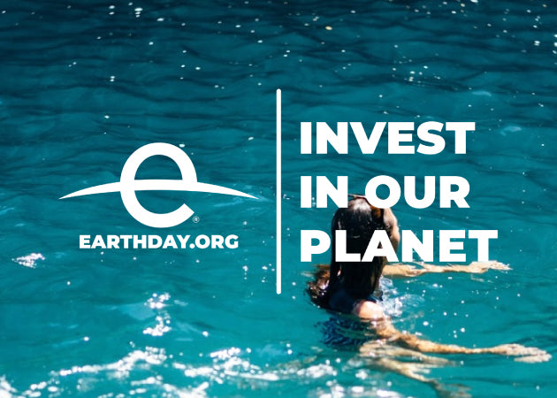 The logo from EarthDay.org - Invest in Our Planet pictured on top of a woman swimming in deep blue waters