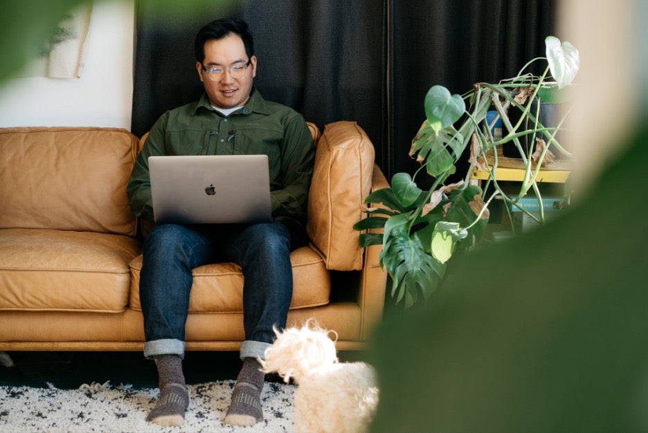 man works from home on laptop while wearing cooper screensaver glasses by distil union