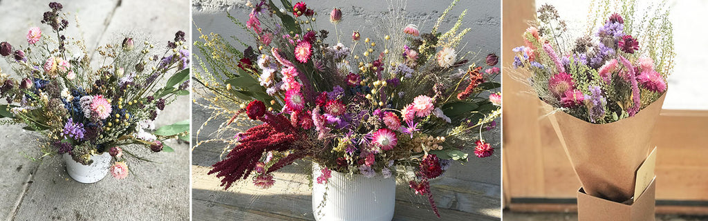 Three beautiful dried flower bouquets of different sizes in pinks, purples, blues, and whites.