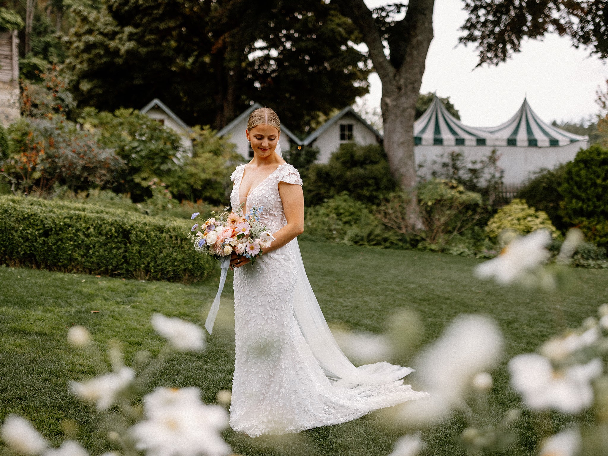 Bride holding bouquet with garden backdrop