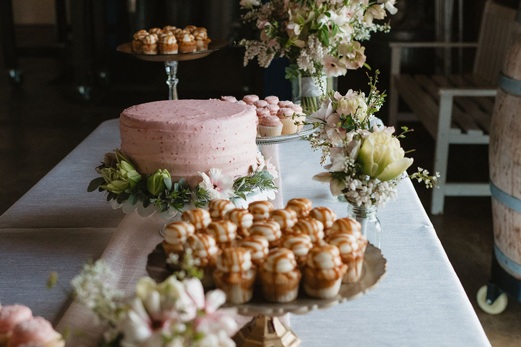 A gorgeous cake table with amazing mini cupcakes and a beautiful cake by Pure Bliss Desserts