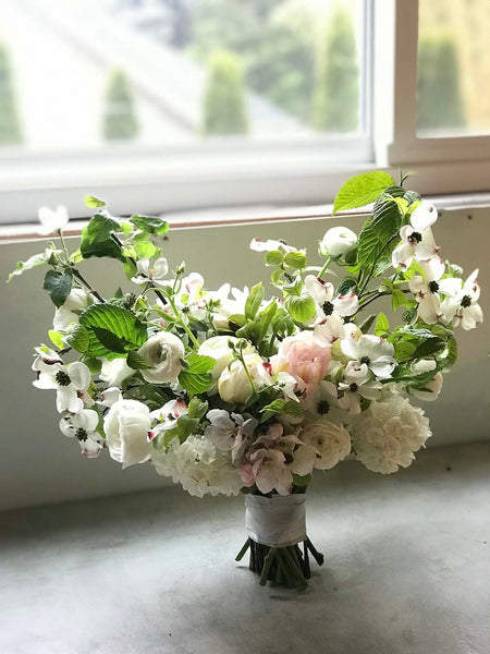 May wedding bouquet with viburnum and dogwood flowers.