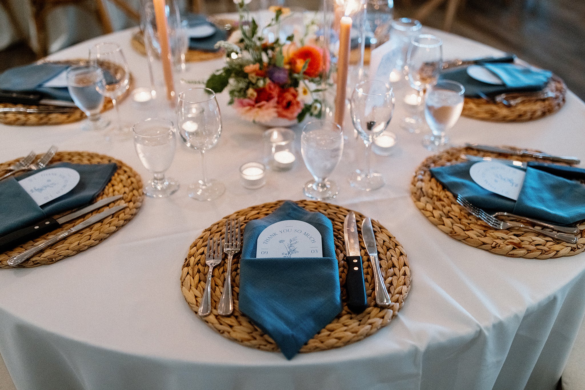Centerpieces and place settings at Coastal English Garden Wedding at Roche Harbor Resort
