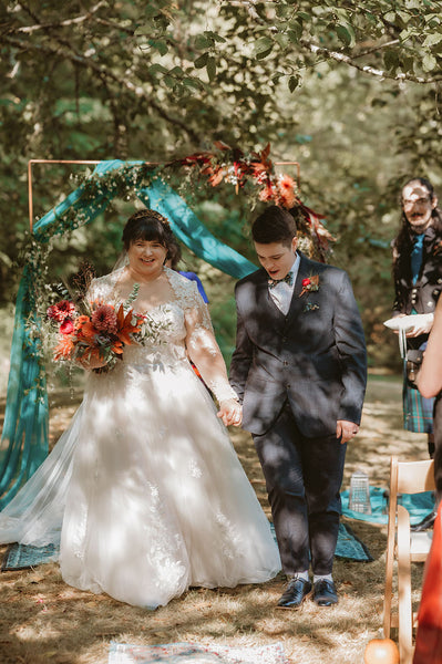 Walking down the woodland aisle for this intimate wedding at Beau Lodge.
