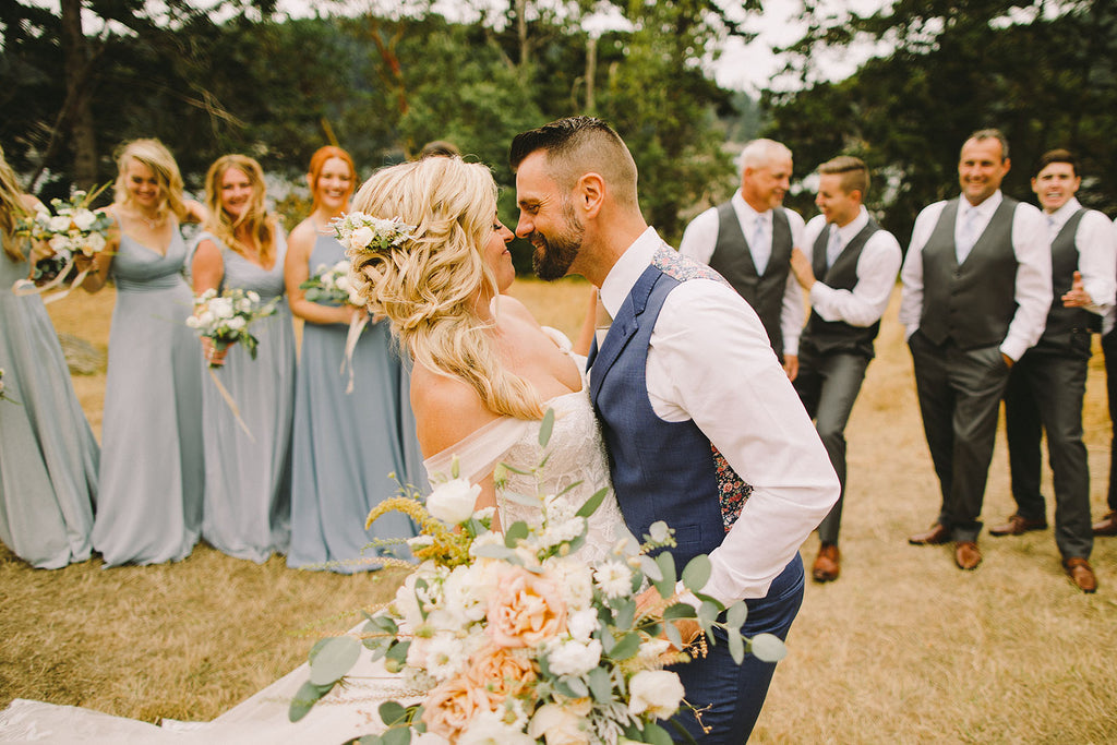 Kissing Couple at Woodstock Farm Wedding Florals