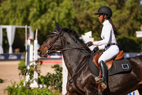 Zoie Brogdon riding in her Custom Essential Square Pad, Custom Ear Bonnet, & Custom ImpacTeq Half Pad.