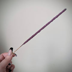 hand holding incense stick 