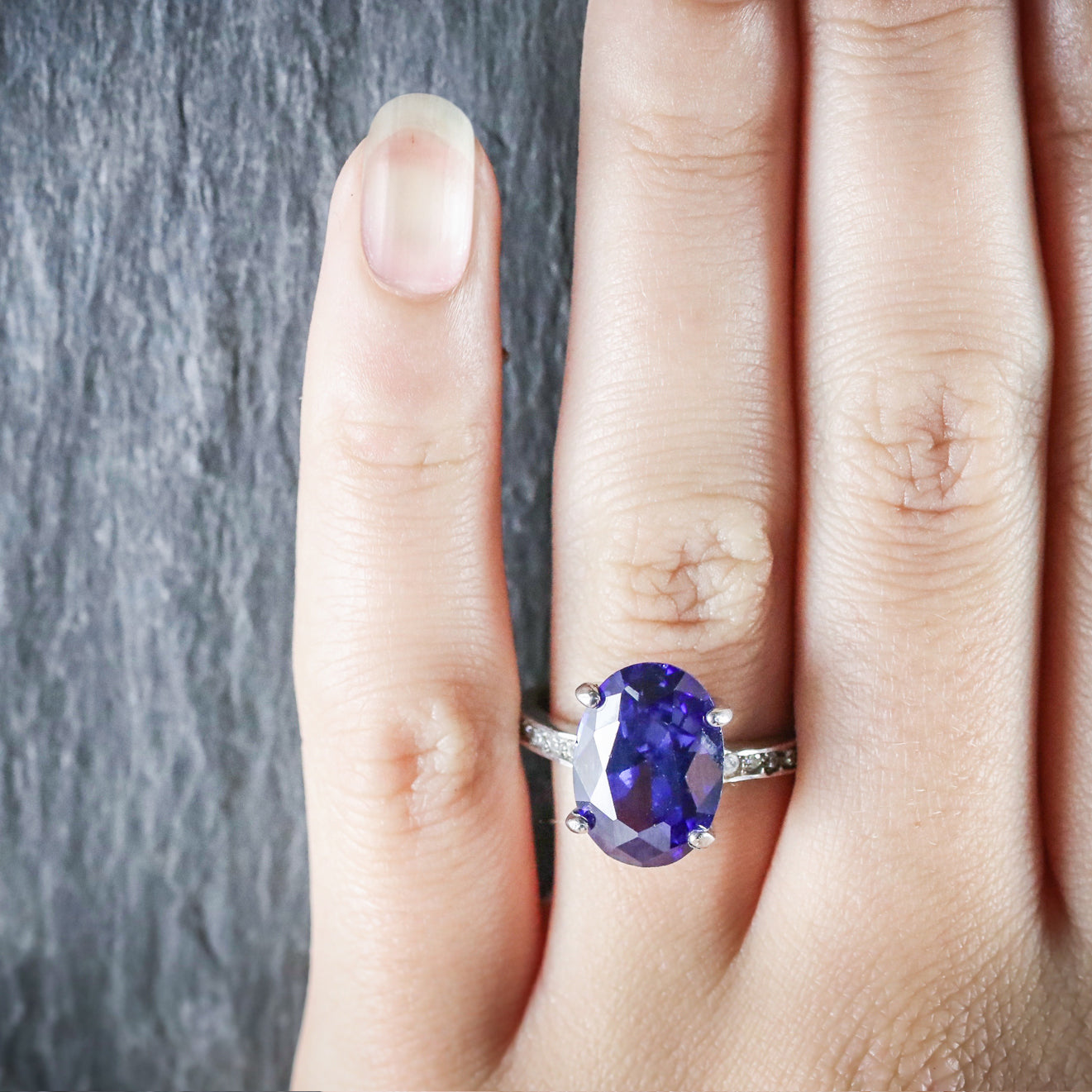 simple solitaire round tanzanite crown setting engagement ring