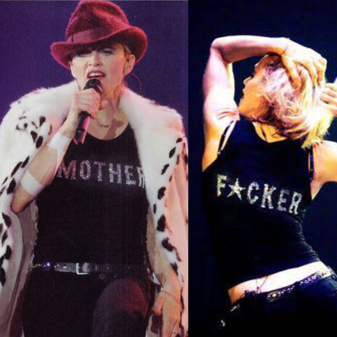 Madonna on stage wearing a T-shirt reading Mother Fucker