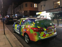 Police car with rainbow stickers in Brighton