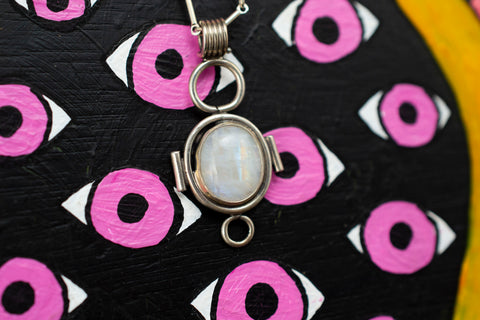 Moonstone necklace on painted background