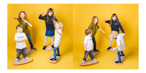 Children playing on balance boards