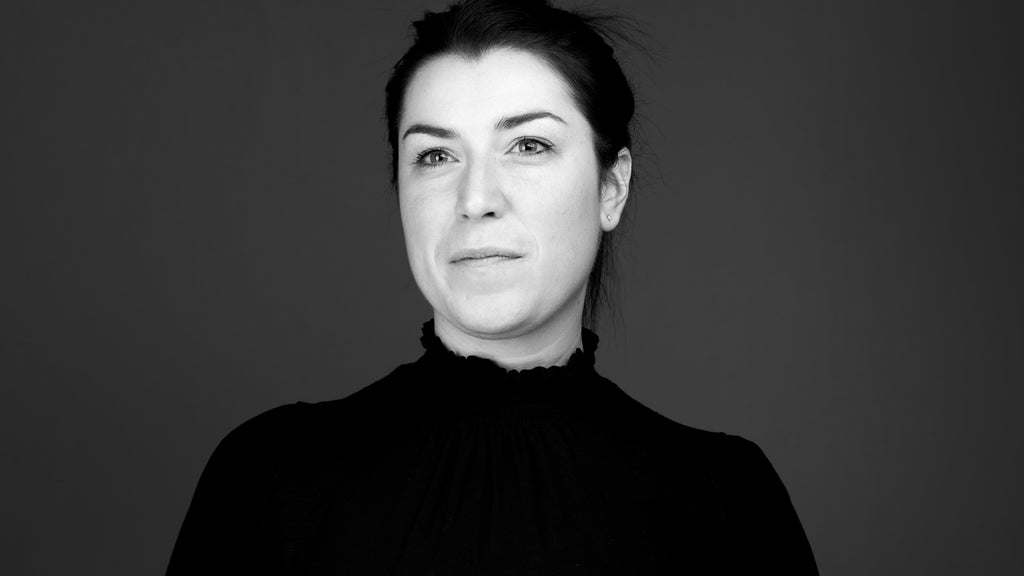 black and white professional headshot of tara charlton