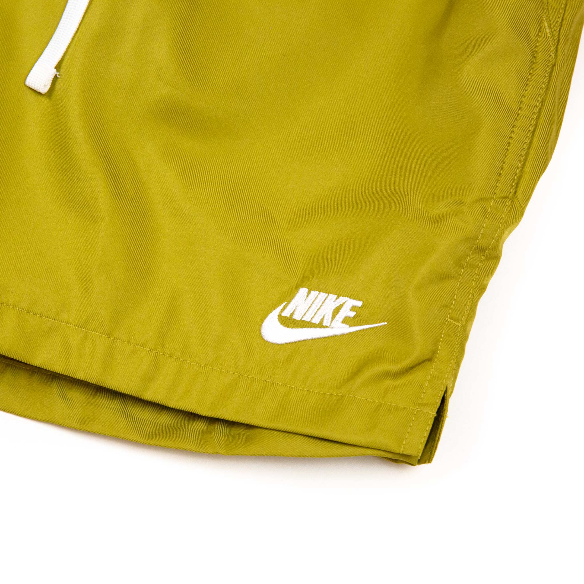 yellow nike woven shorts