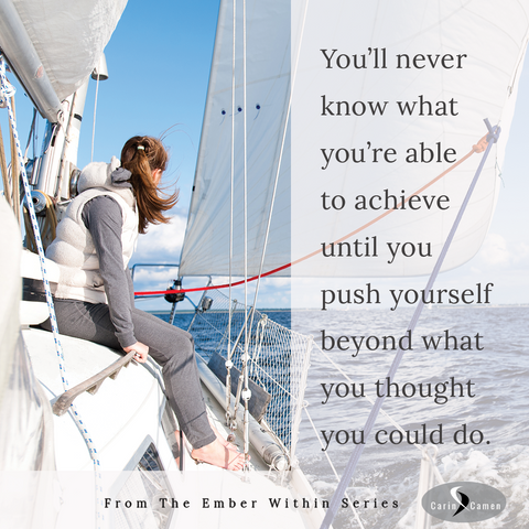 Woman sitting on edge of boat looking at the horizon.