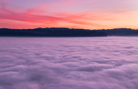 Sunset above clouds.