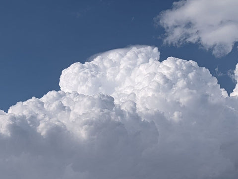 Billowing clouds against a beautiful blue sky.