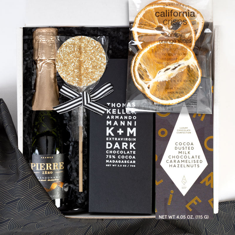 The perfect Valentine's Gifts for him. Gifts include chocolate, champagne lollipop, zero alcohol sparkling wine and more.