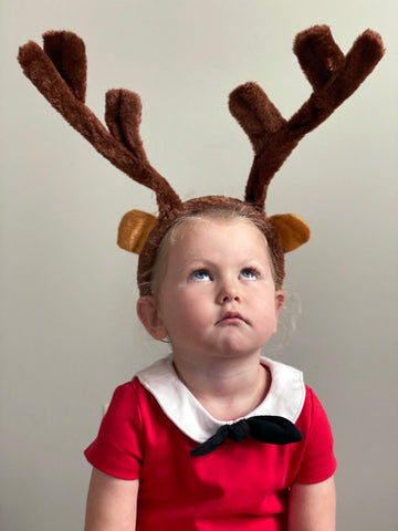 Toddler in soft reindeer antler headband