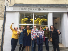 Nicky and six other women stand outside Frome Yarn Collective on its opening day with their fists held high in a comradely salute.