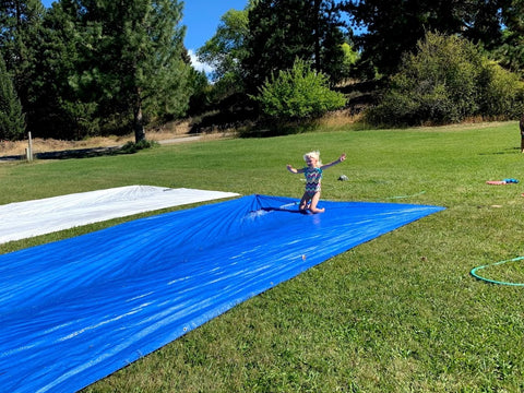 Pearl on homemade slipnslide at coral farms summer camp