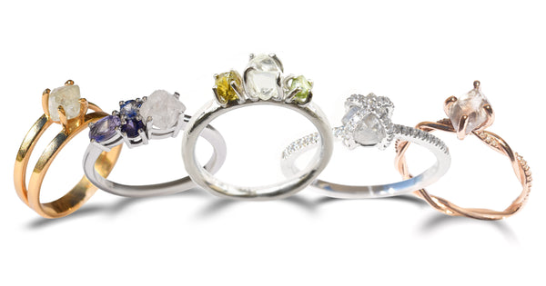 Rough diamond and sapphire ring styles in a row