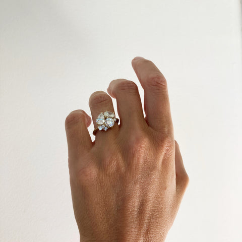 Geometrical engagement ring in a bouquet setting