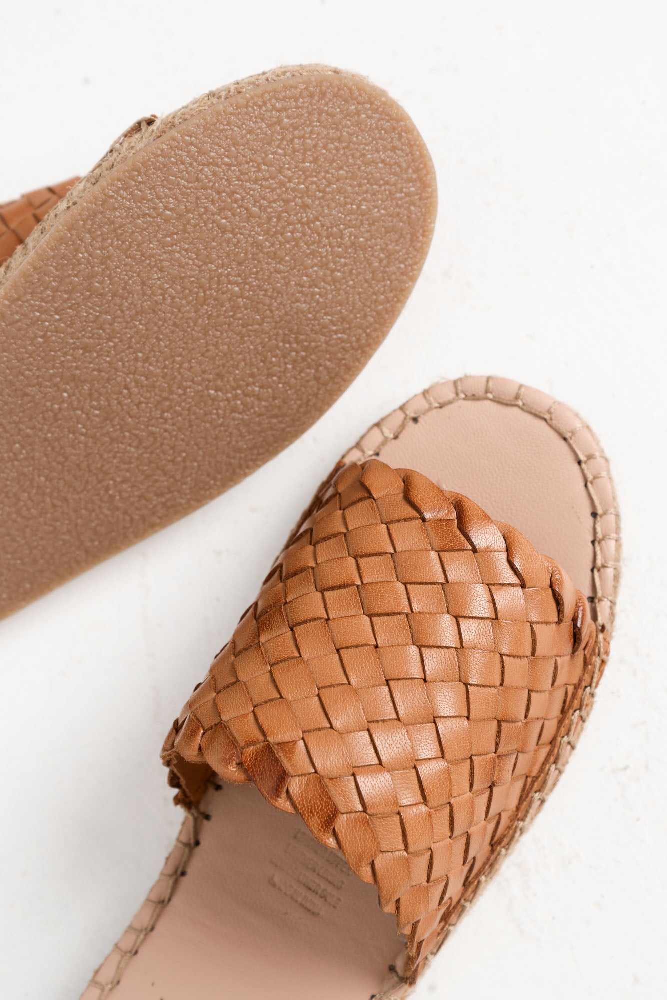 tan woven leather slides