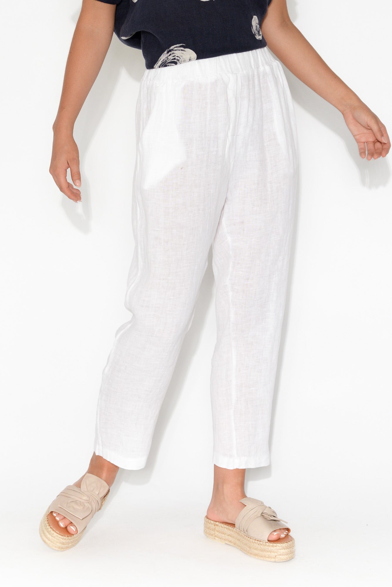 white linen tapered trousers