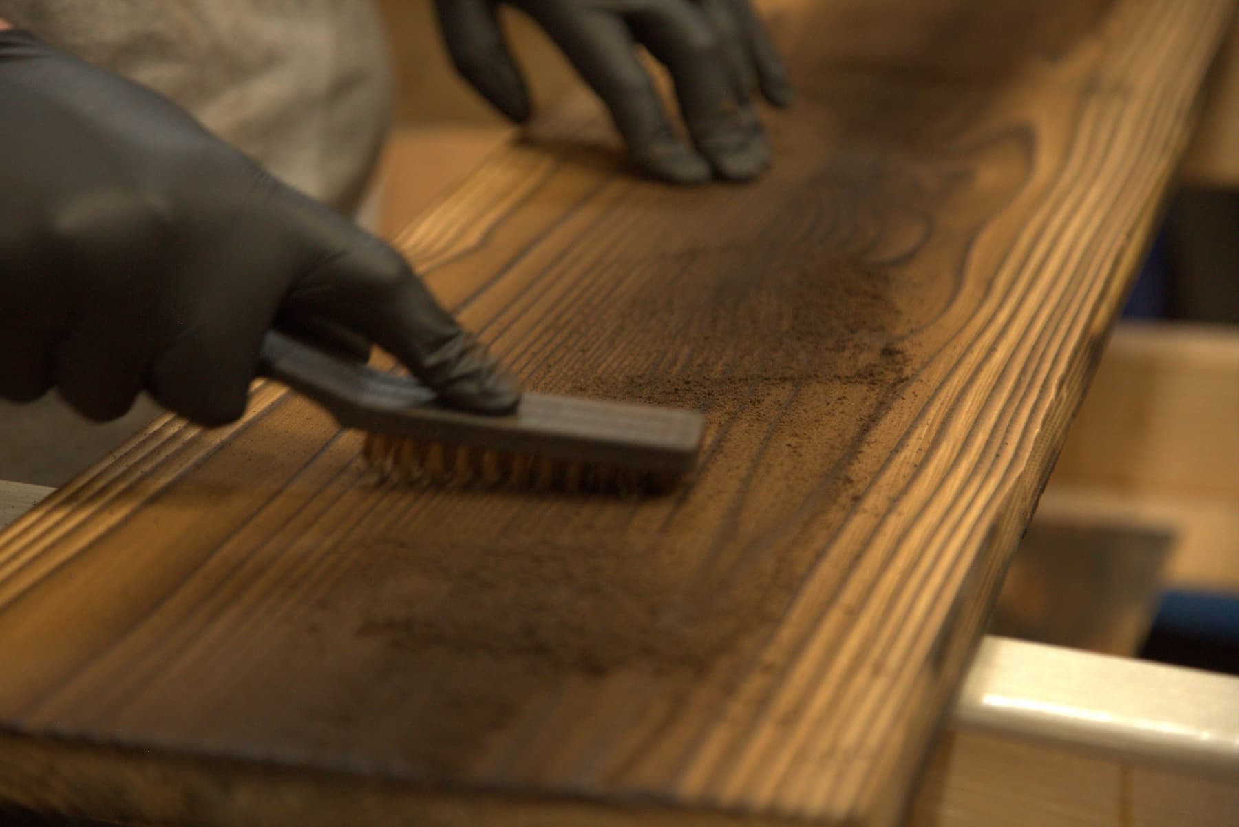 close up of wood brushing in process